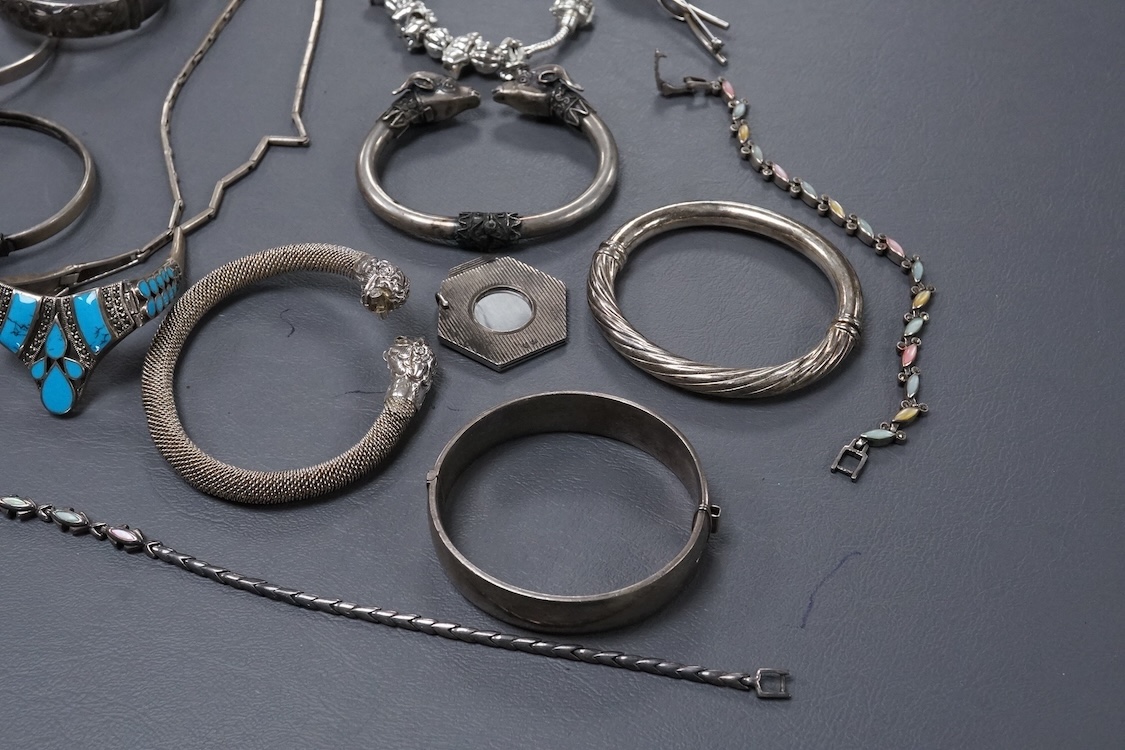 A group of assorted jewellery, including silver and white metal hinged bangles, a 1960's silver mounted cigar cutter by Ramsden & Roed, 925 necklaces and bracelet, etc.